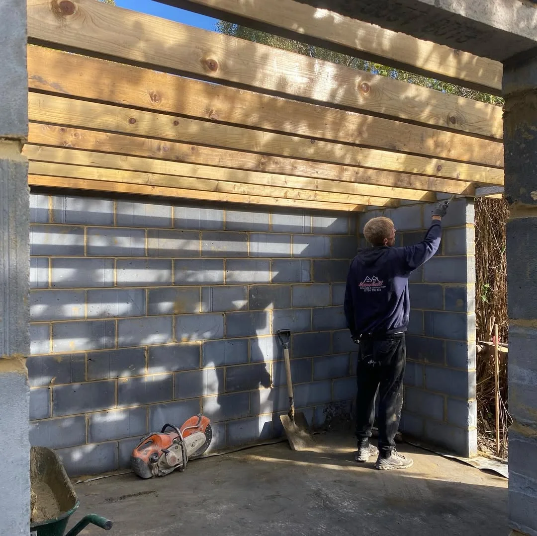 Our team at work on a block wall